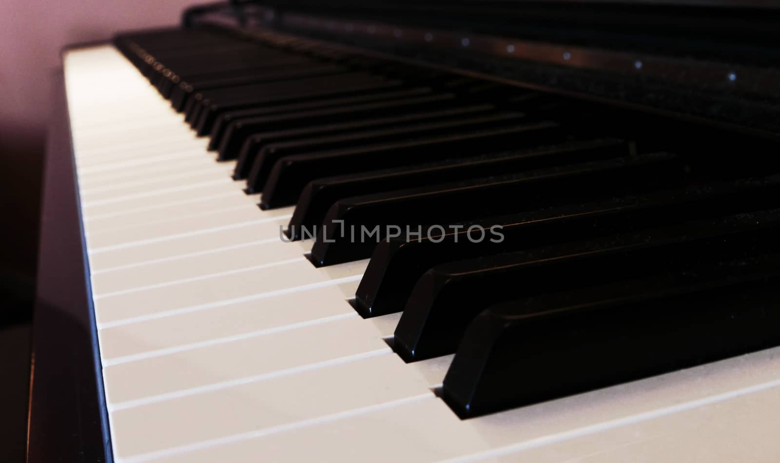 Keyboard of piano close-up, focus at the front