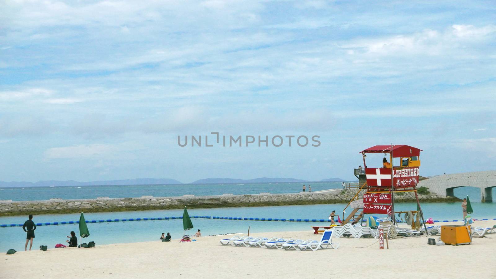 Red lifeguard stand and chair in the beach by cougarsan