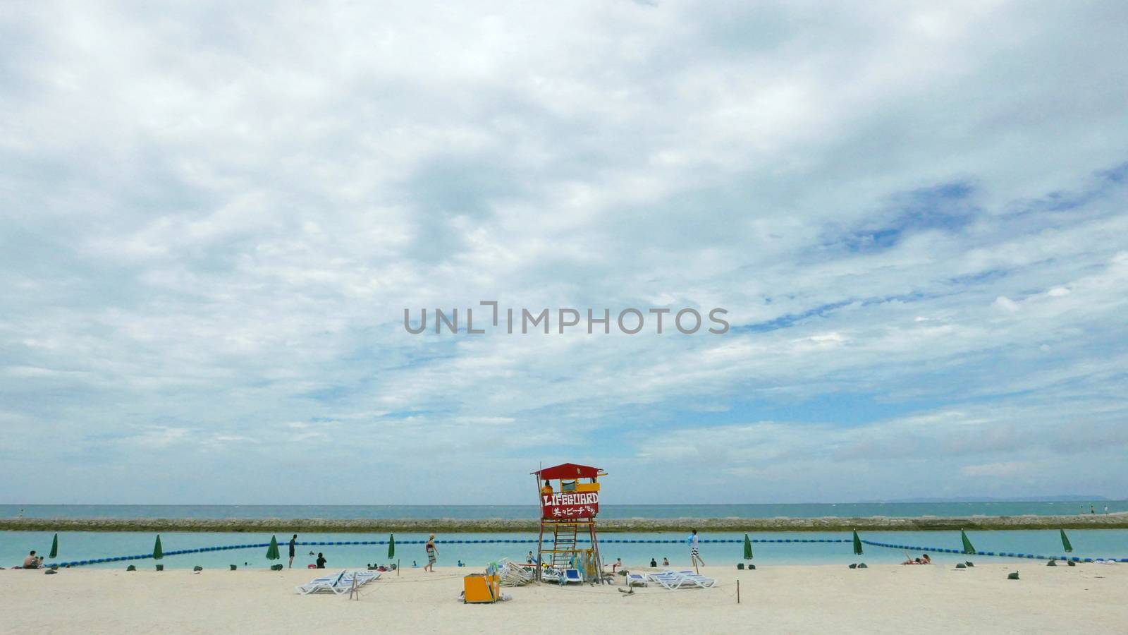 Red lifeguard stand and chair in the beach