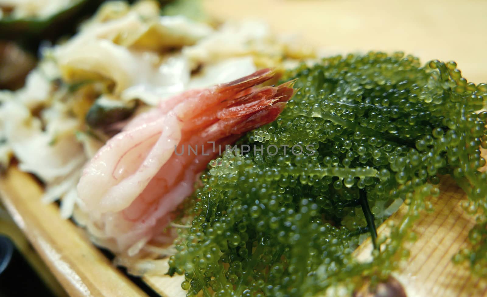 Japanese food seaweed salad with raw shrimp sashimi