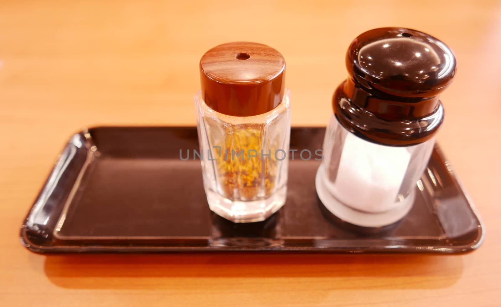 Salt shaker on the black tray