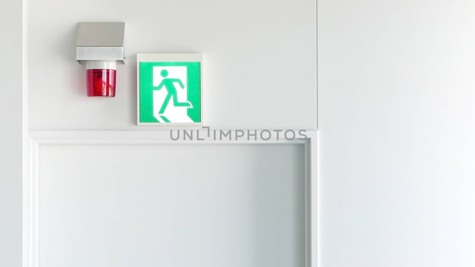 Green emergency exit sign and red alarm light by cougarsan