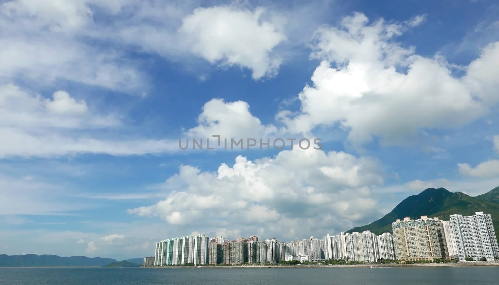 Hong Kong residential buildings cityscape, cloudscape and blue sky by cougarsan