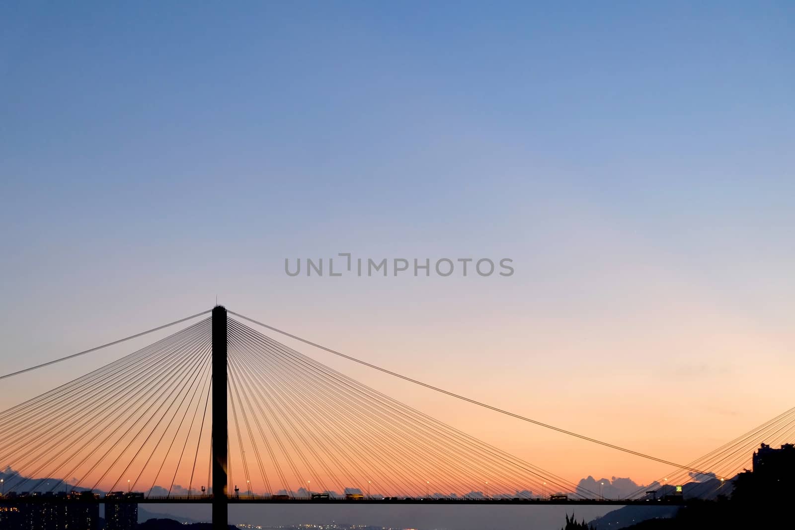 Sun and silhouette bridge at sunset