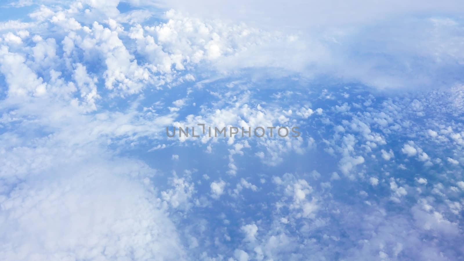 Nice natural clouds in the blue sky from aerial view