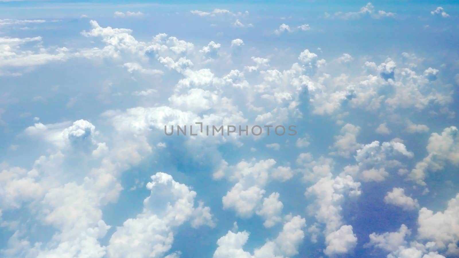 Nice natural clouds in the blue sky from aerial view