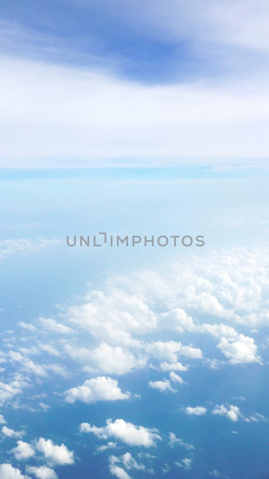 Nice natural clouds in the blue sky from aerial view