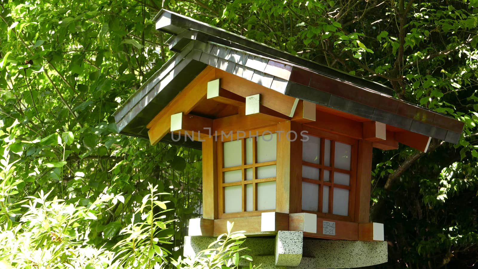 Outdoor traditional wooden lamp in the zen garden by cougarsan