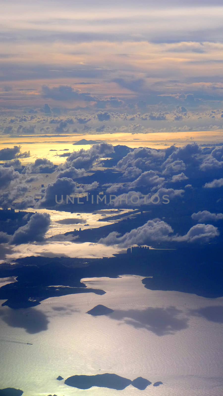 vertical sunset landscape view above the clouds