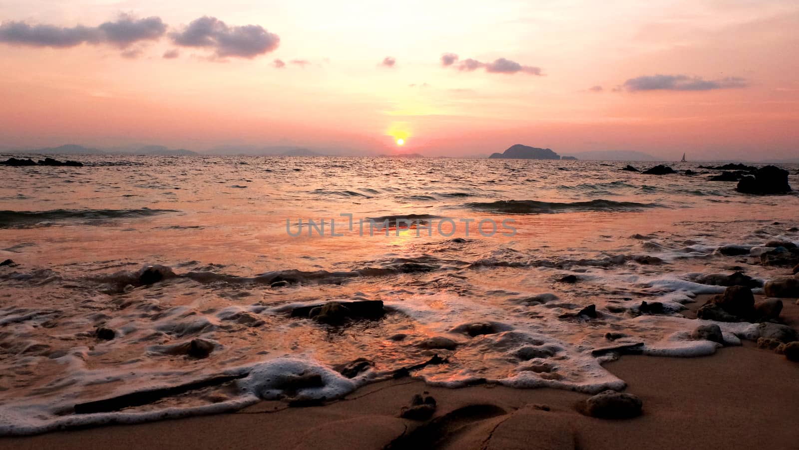 beautiful ocean, waves and beach at sunset