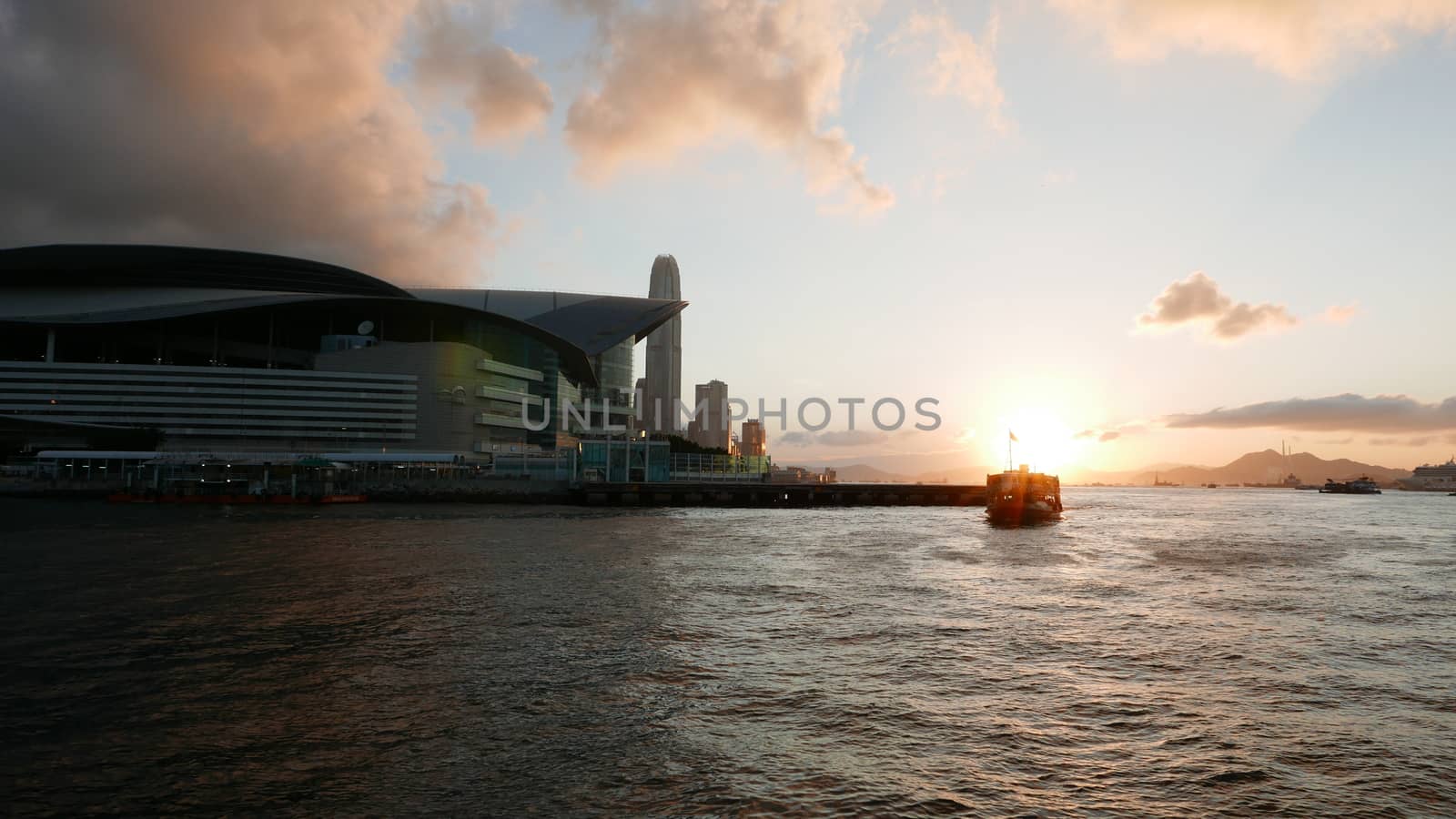 Hong Kong Victoria River, ferry and buildings at sunset
