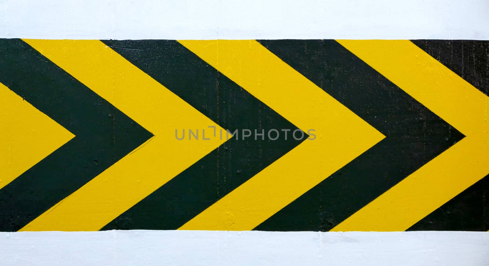 Right yellow and black wall warning road sign