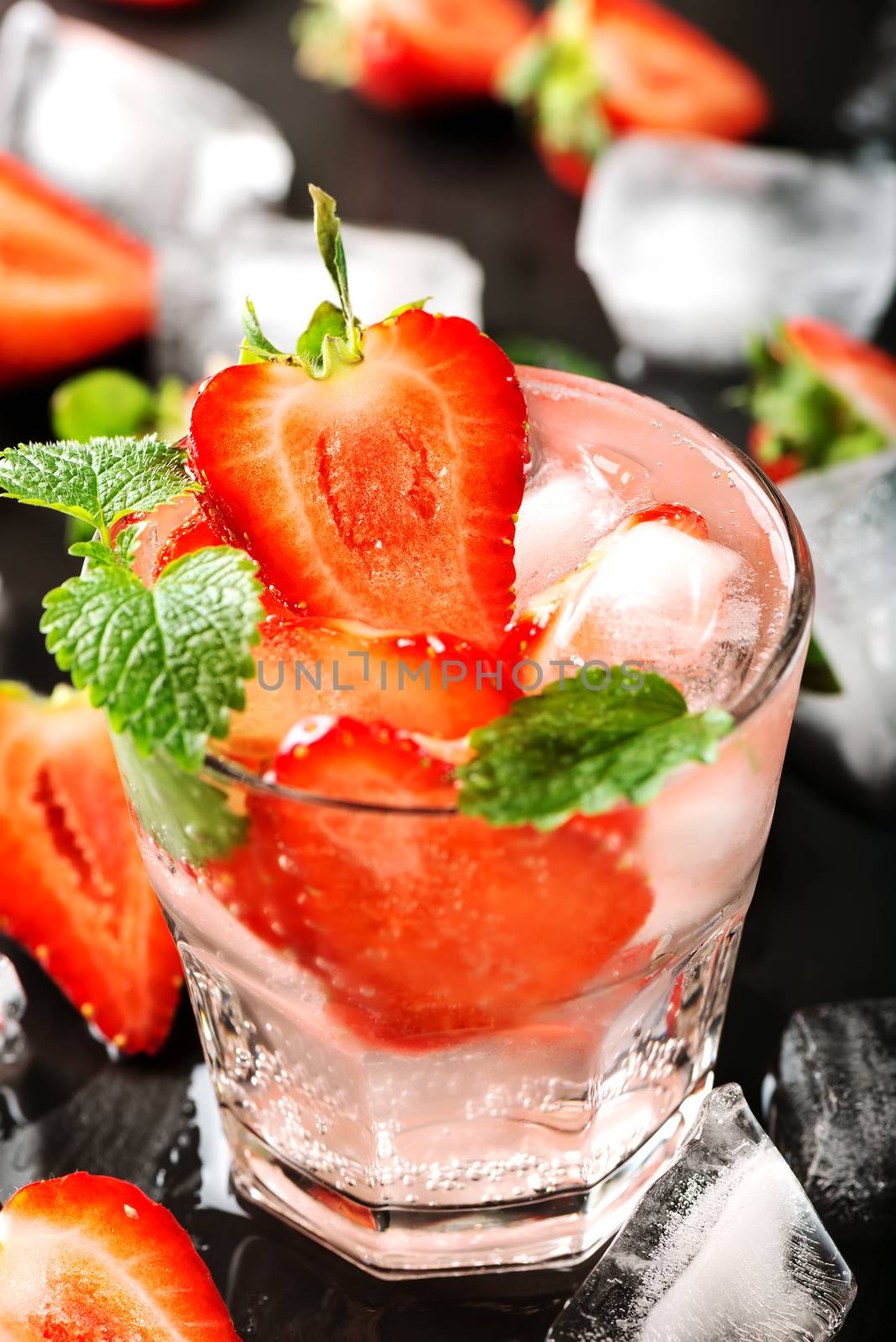 Fresh strawberry drink on dark background