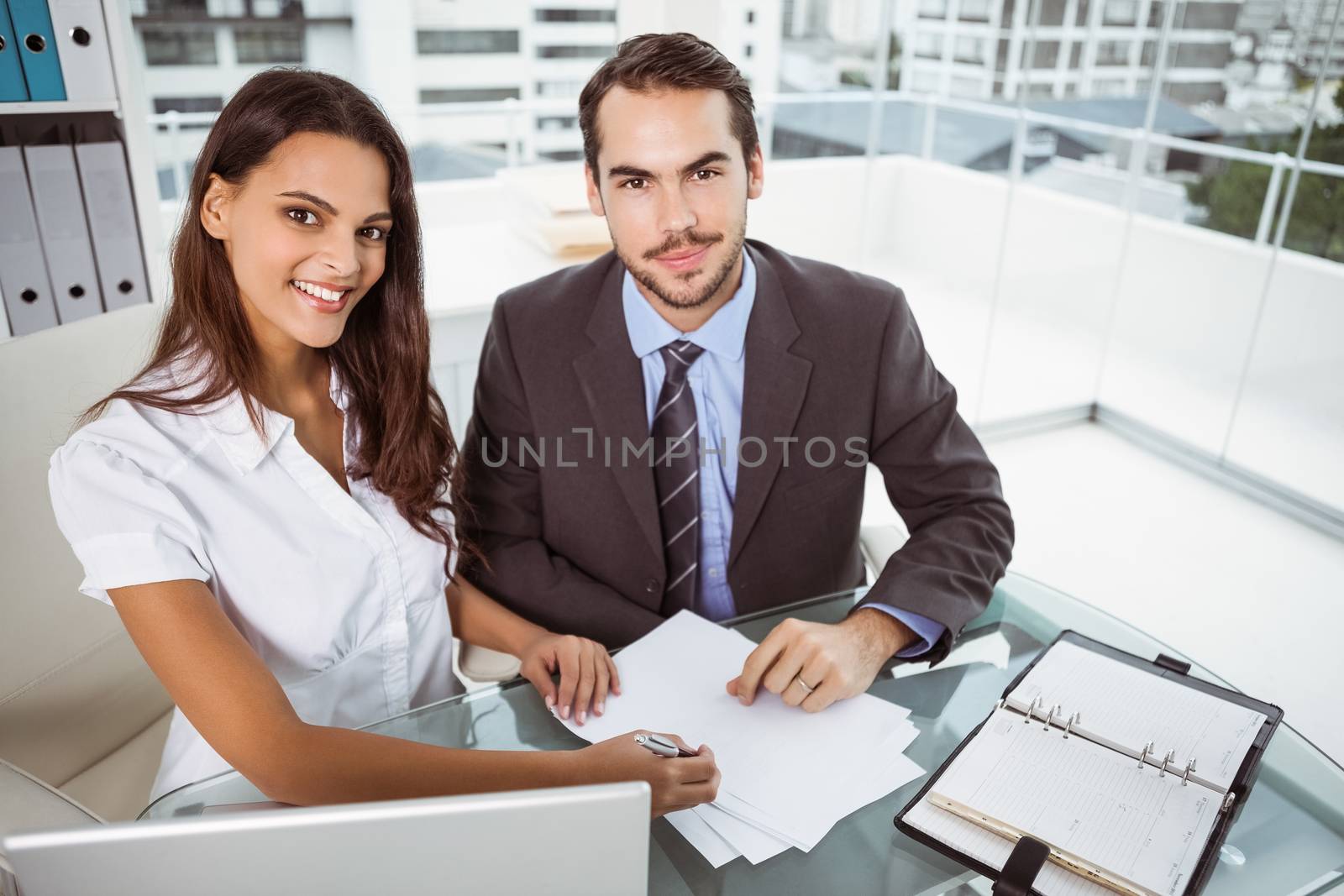 Two young business people in meeting at office