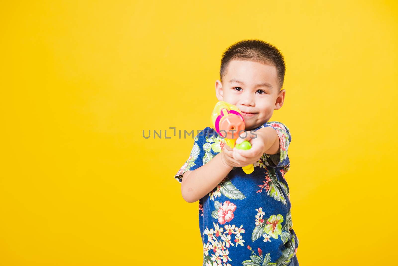 little children boy so happy in Songkran festival day holding wa by Sorapop