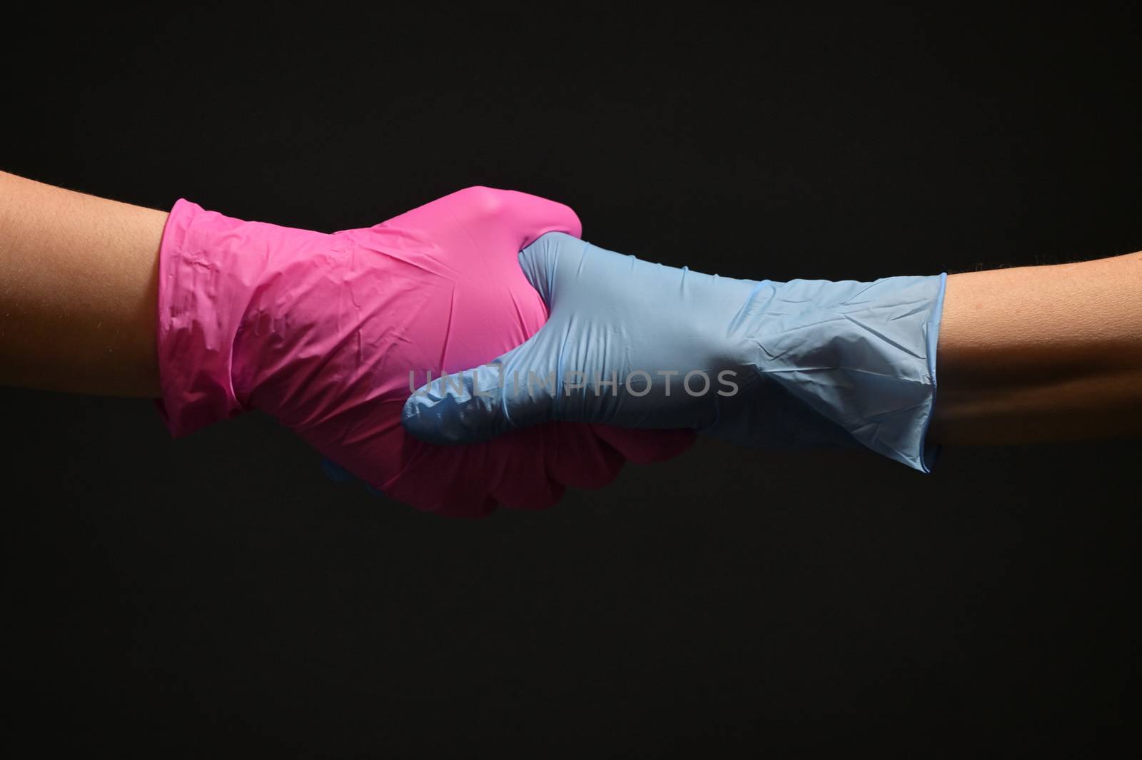 Man And Doctor Holding Hands Wearing Medical Gloves  by mady70