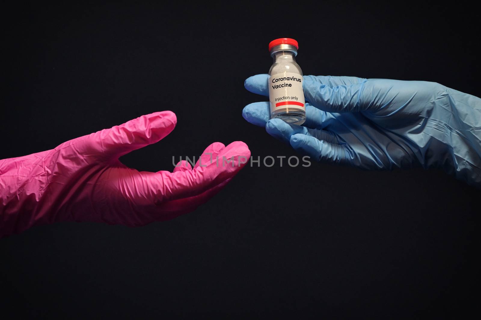 Woman Hand With Glove Giving Coronavirus Vaccine by mady70