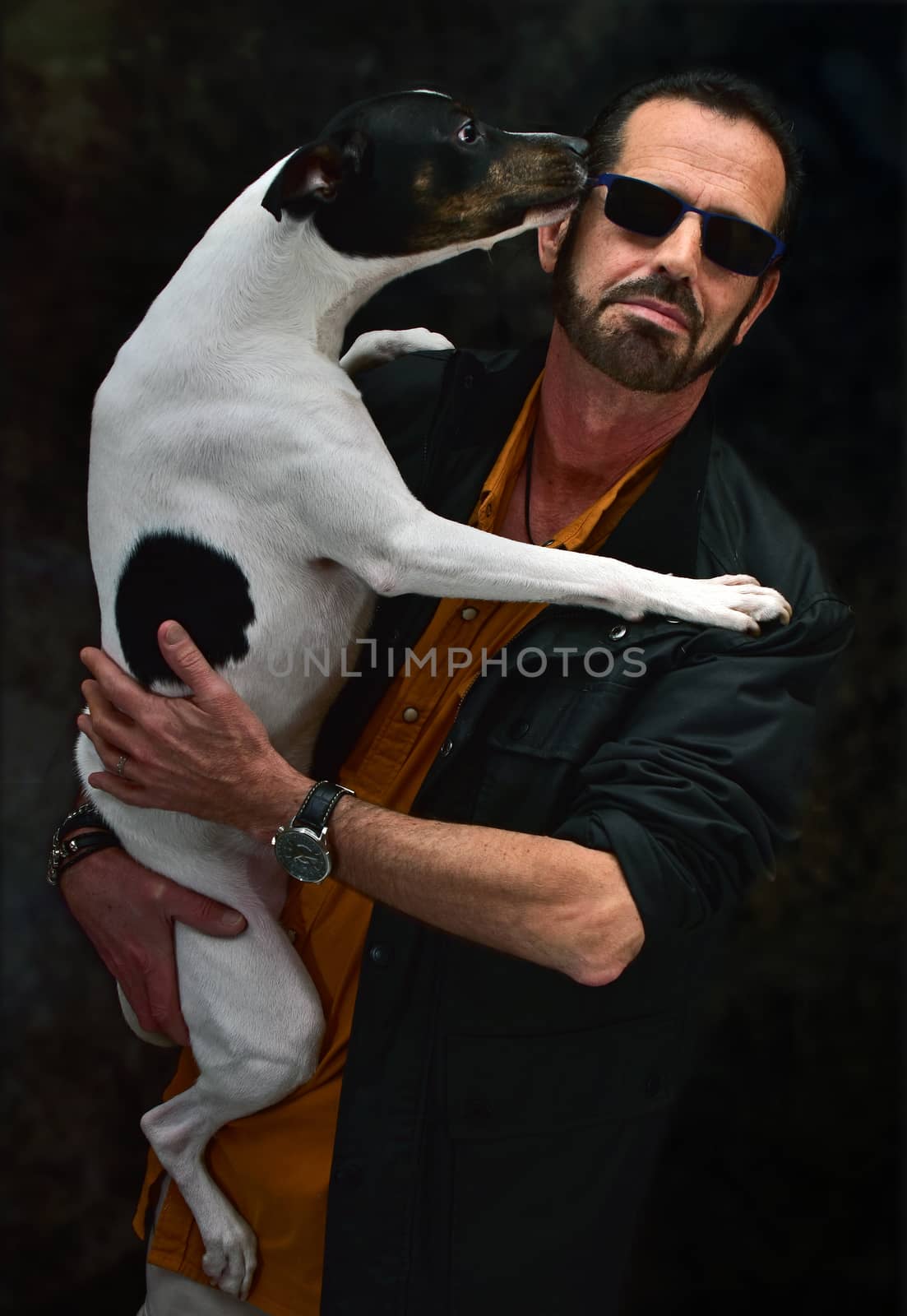 man posing with his dog in his arms by mrcorento