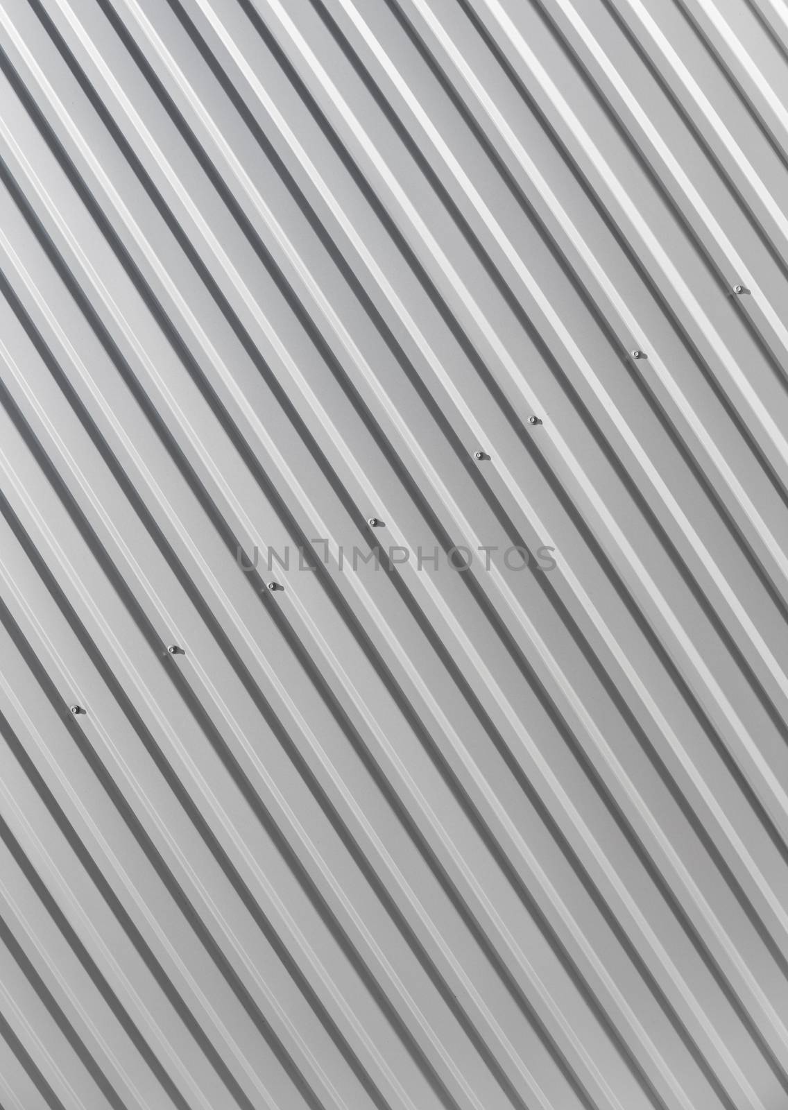 Metal white sheet for industrial building and construction on blue sky background. Roof sheet metal or corrugated roofs of factory building or warehouse