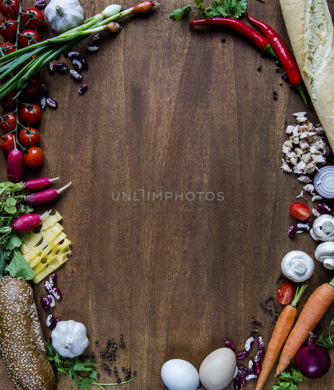 Vegetables, cheese, bread and eggs on wood. Bio Healthy food, herbs and spices. Organic vegetables on wood. Mock up with vegetables