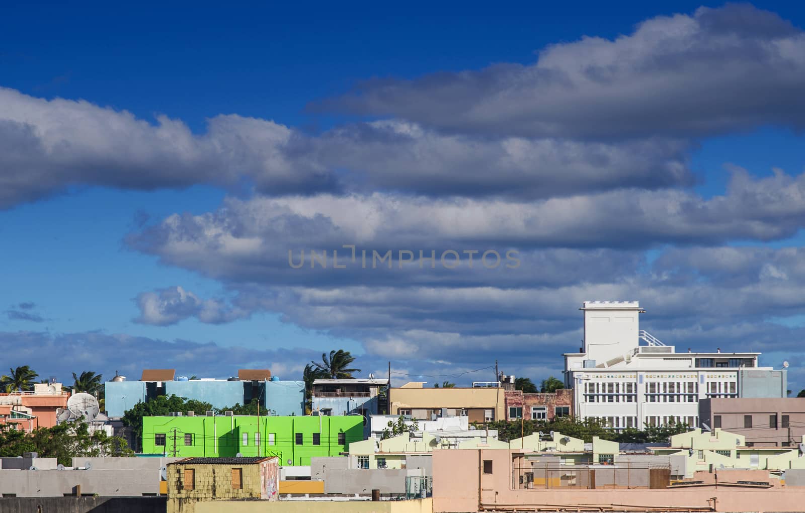 Green Building in Colorful Puerto Rico Cityscape by dbvirago