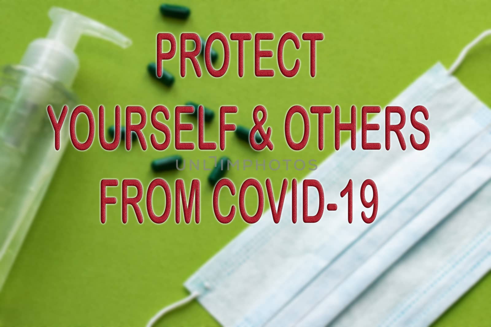Text about prevention of coronavirus against a background of hand sanitizing gel and medical protective surgical mask on a green background. Hygienic concept of protection from Covid-19