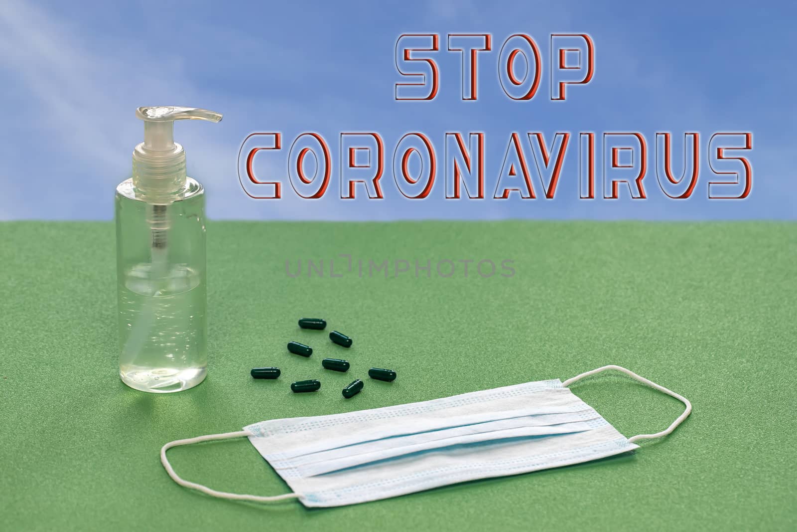 Text about prevention of coronavirus against a background of hand sanitizing gel and medical protective surgical mask on a green background. by bonilook