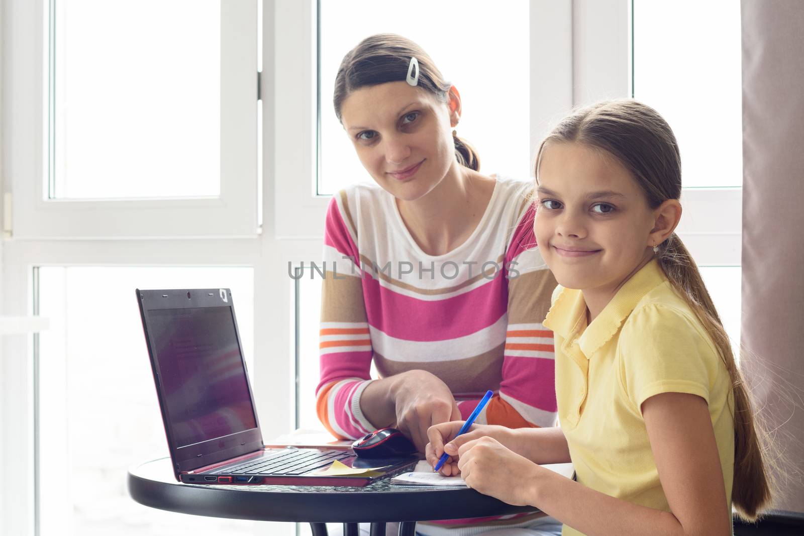 Tutor and student distracted from class and looked into the frame