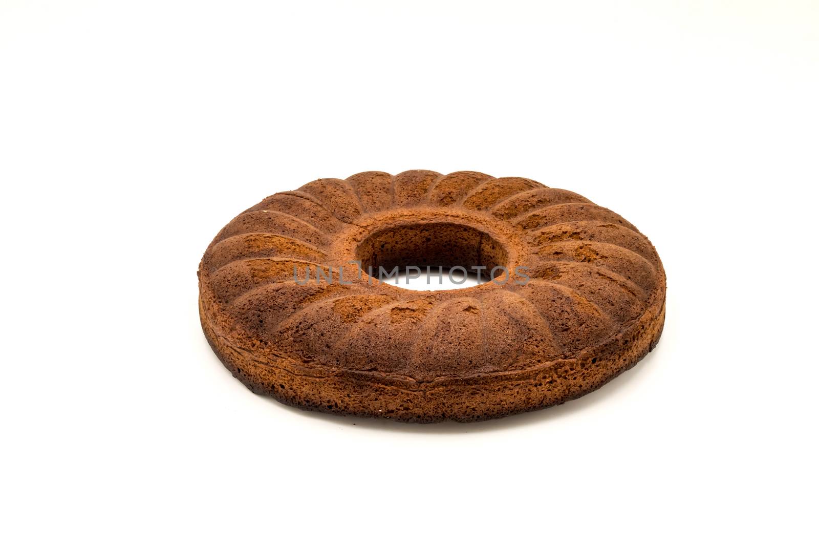 Circular marbled cake laying on a white background
