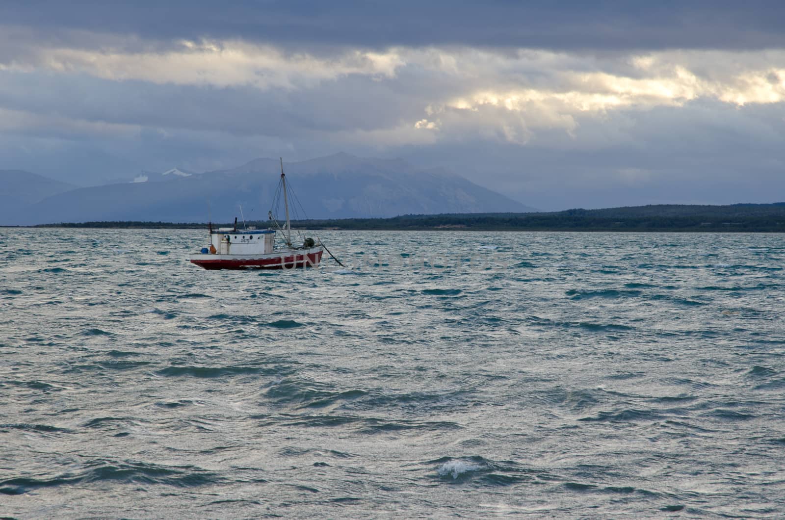Fishing boat in the Ultima Esperanza Inlet from Puerto Natales. by VictorSuarez