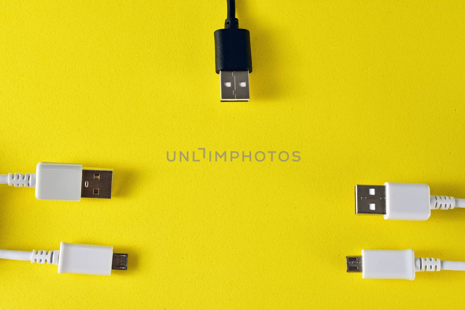 usb cables to transmit data on yellow background