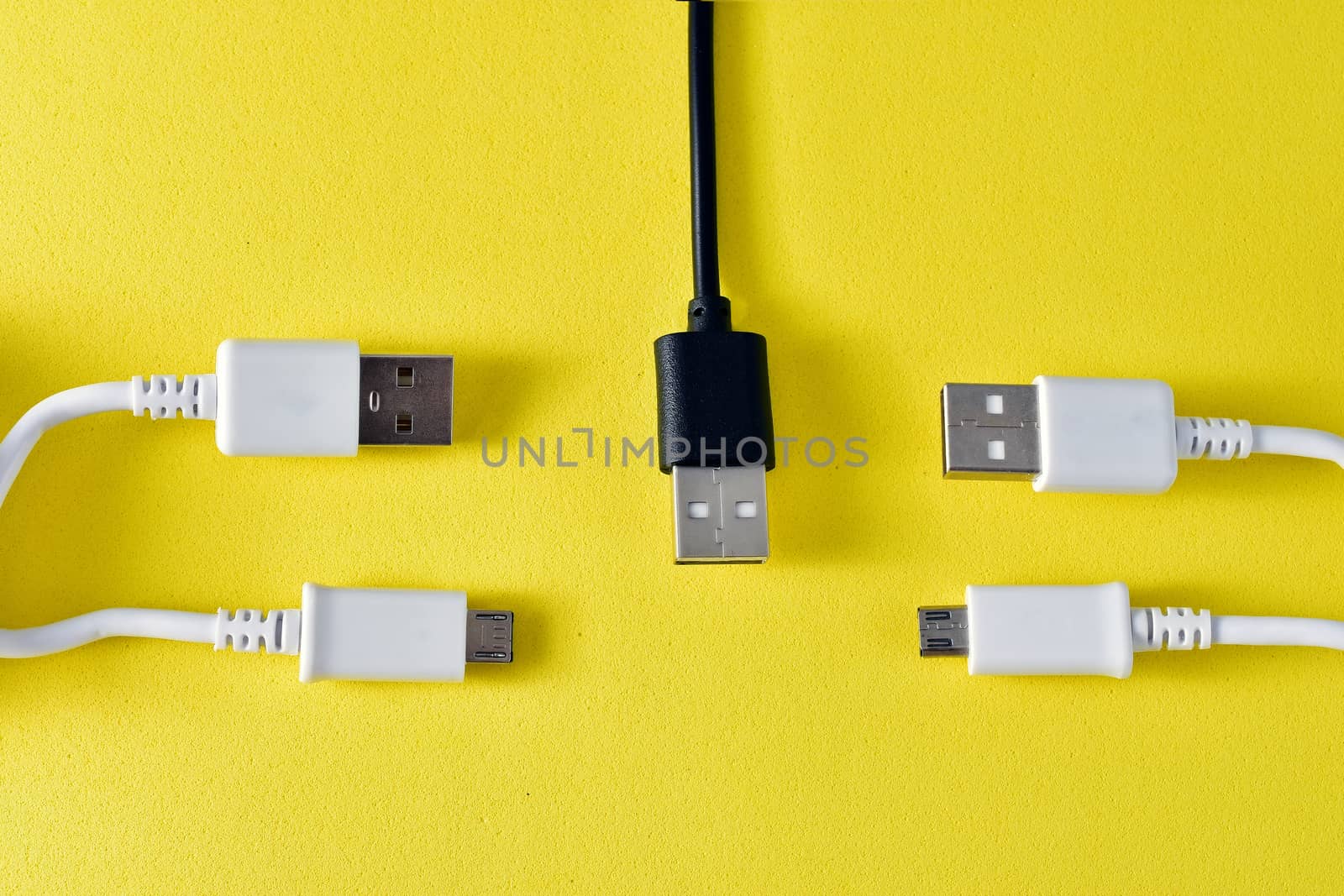 usb cables to transmit data on yellow background