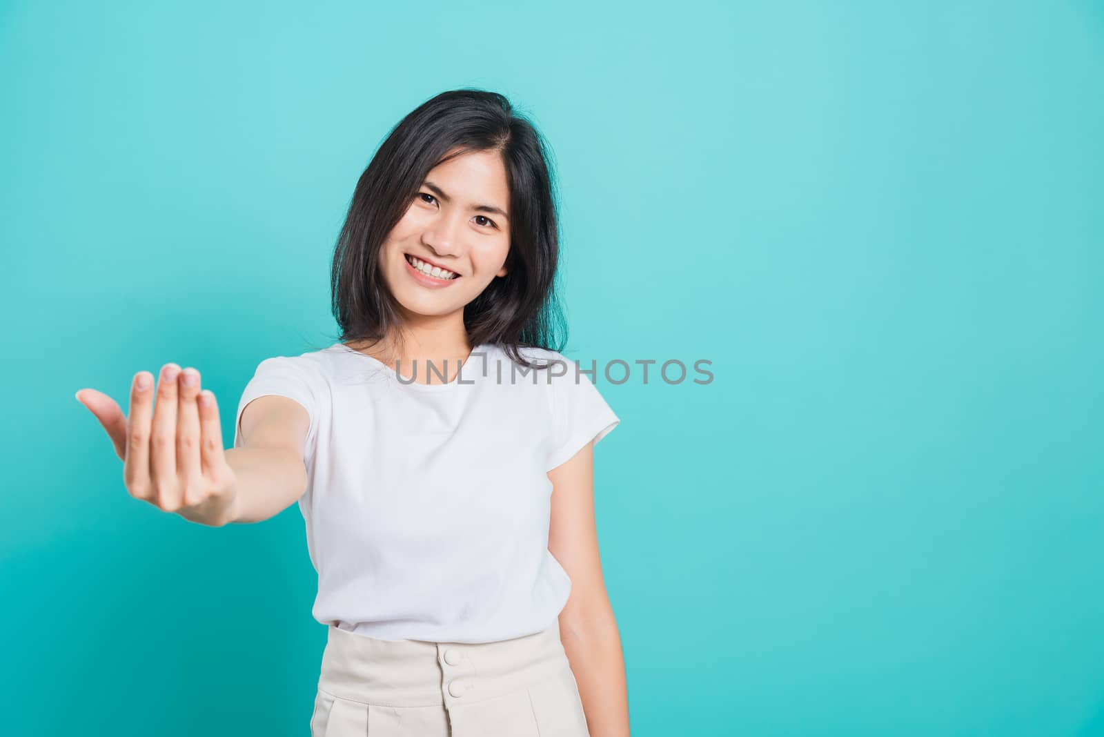 woman smile wear white t-shirt making gesture with hand inviting by Sorapop