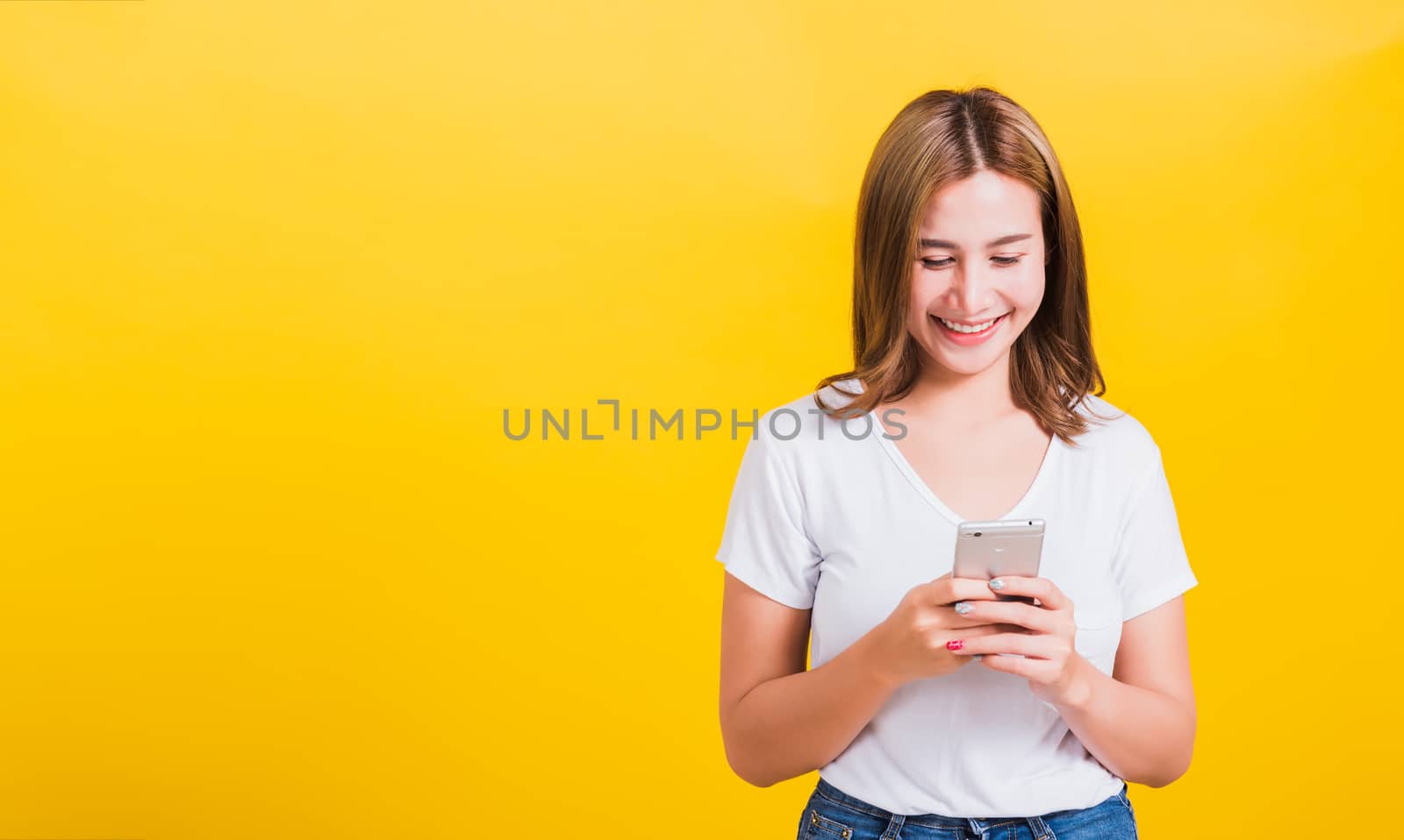 woman teen smile standing playing game or writing message on sma by Sorapop