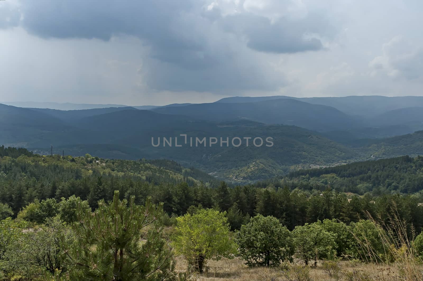 Amazing autumn view of glade, peak and forest with deciduous trees  in Sredna gora mountain, Bulgaria