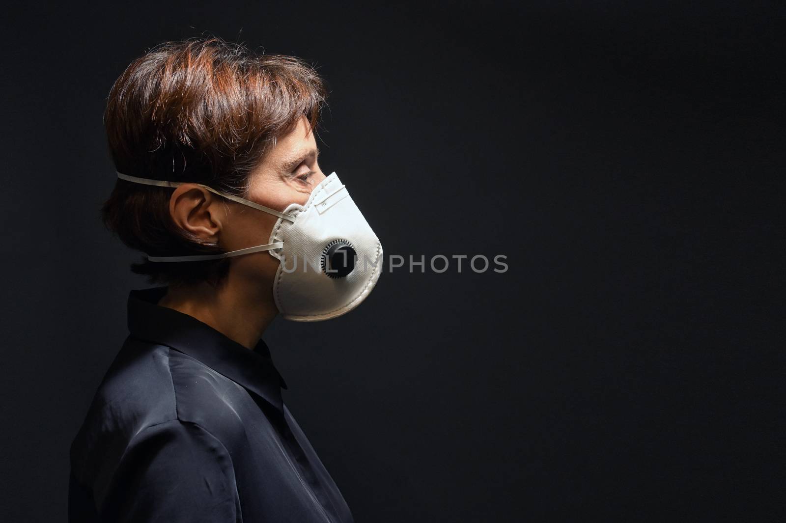 Woman Wearing Medical Protective Virus Mask on dark background