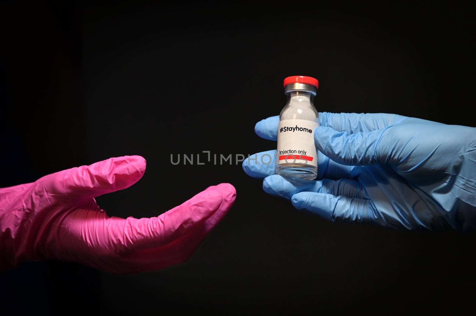 Woman Hand With Glove Giving Stayhome Vaccine to Other Hand