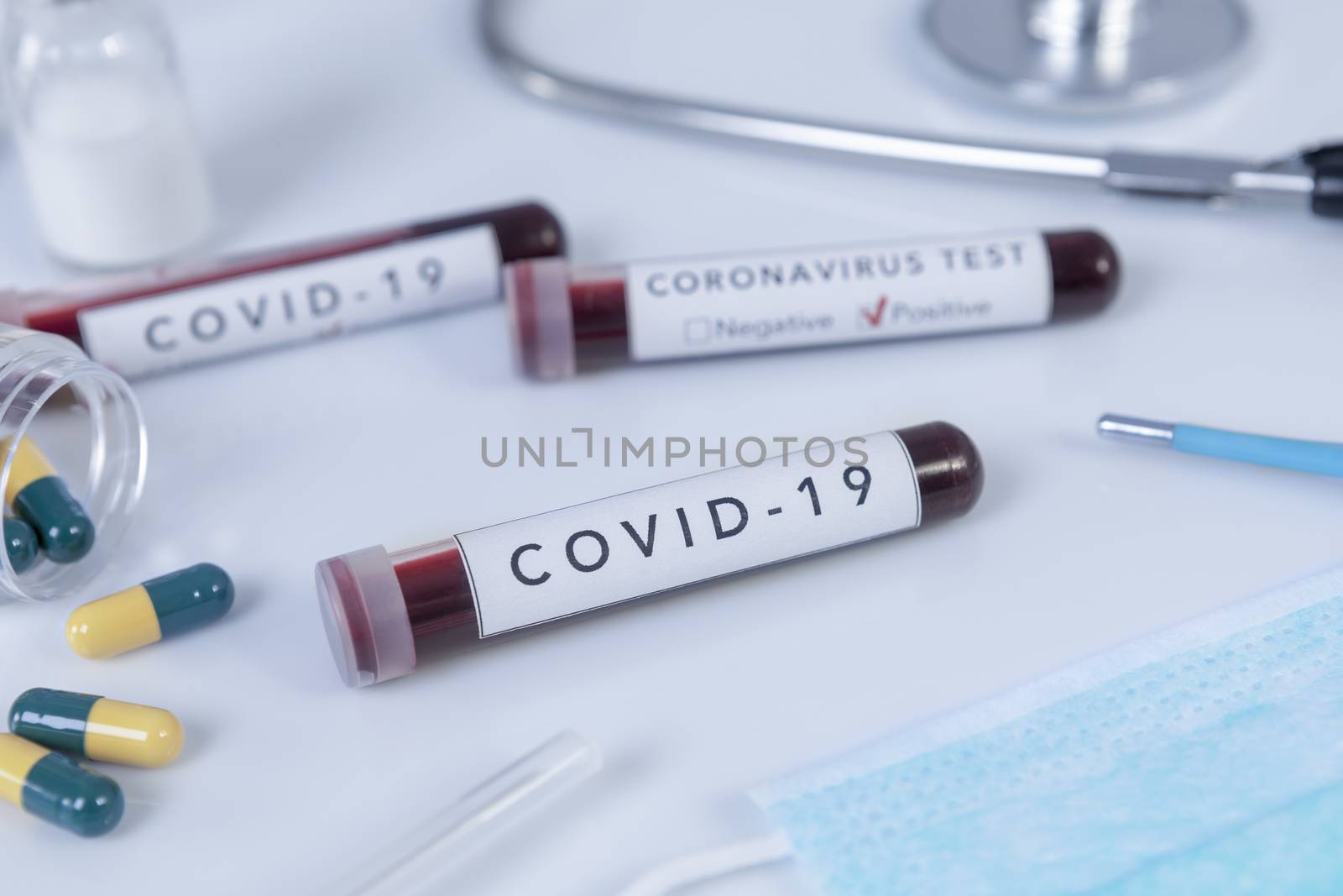 Blood test tube with Coronavirus the COVID 19 disease for virus test and research. Focus on blood test.