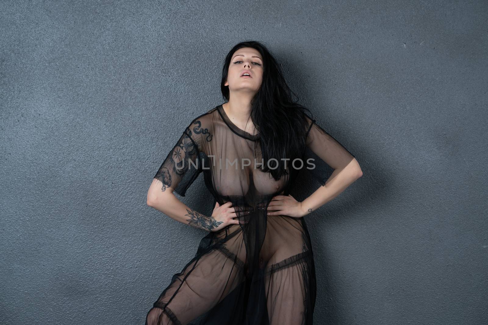 young beautiful girl posing in black lingerie
