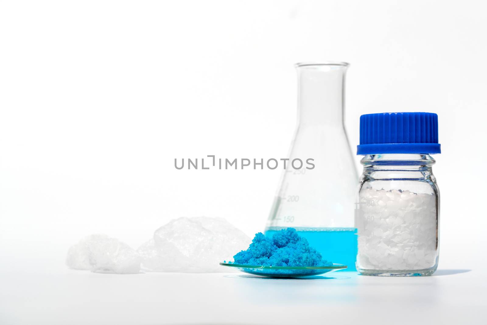 Inorganic chemical on white laboratory table. Copper(II) sulfate, Microcrystalline wax, Nickle Chloride, alcohol. Chemical ingredient for Cosmetics & Toiletries product.