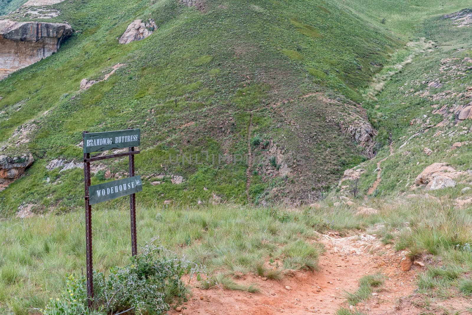 Sign on top of the Brandwag buttress at Golden Gate. The trail leading down to the hotel is visible