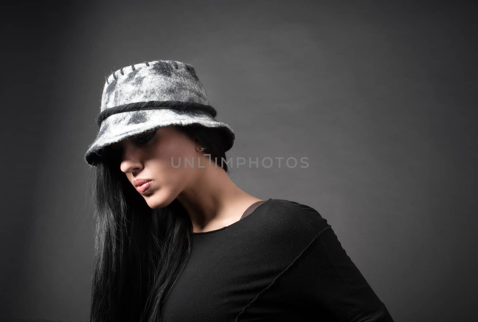 Elegant woman in red vintage hat are thinking