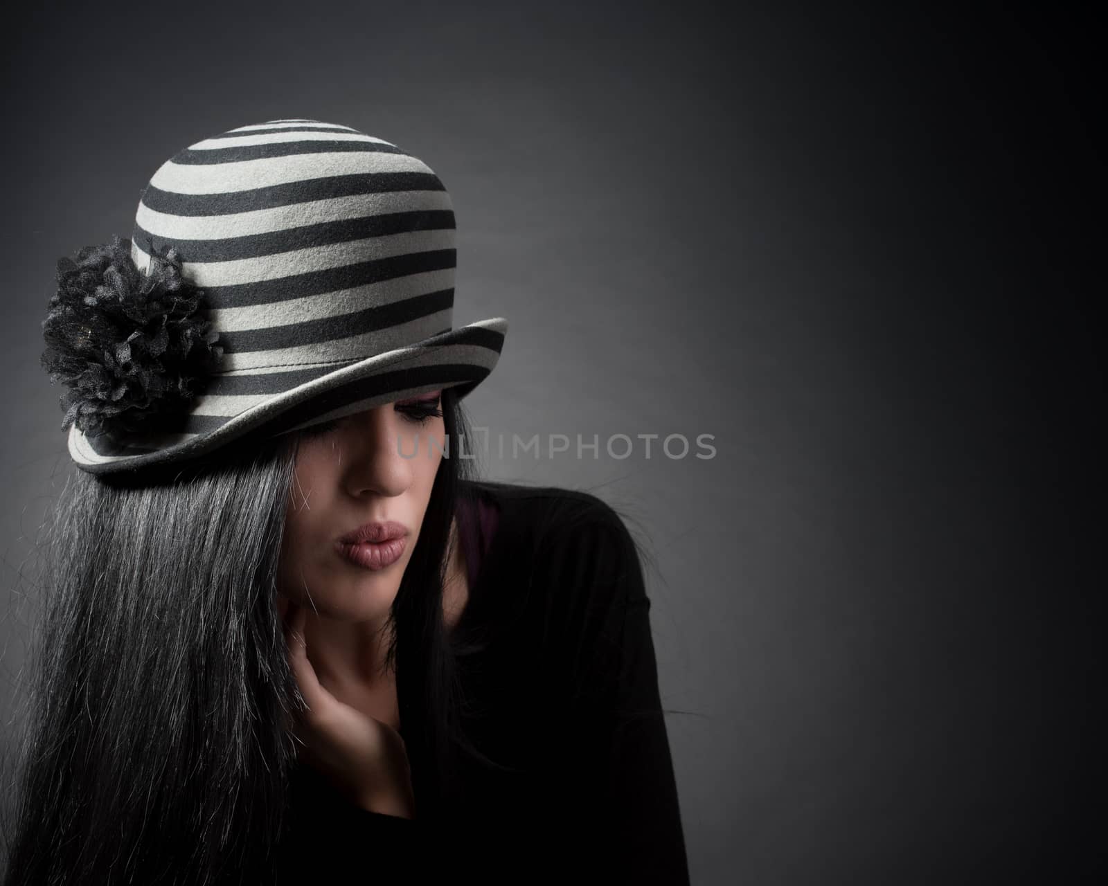 Elegant woman in hat are thinking