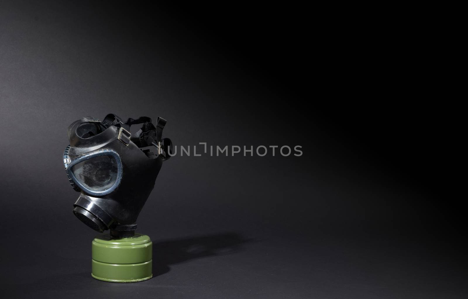 Vintage gasmask isolated on black - Green filter by michaklootwijk