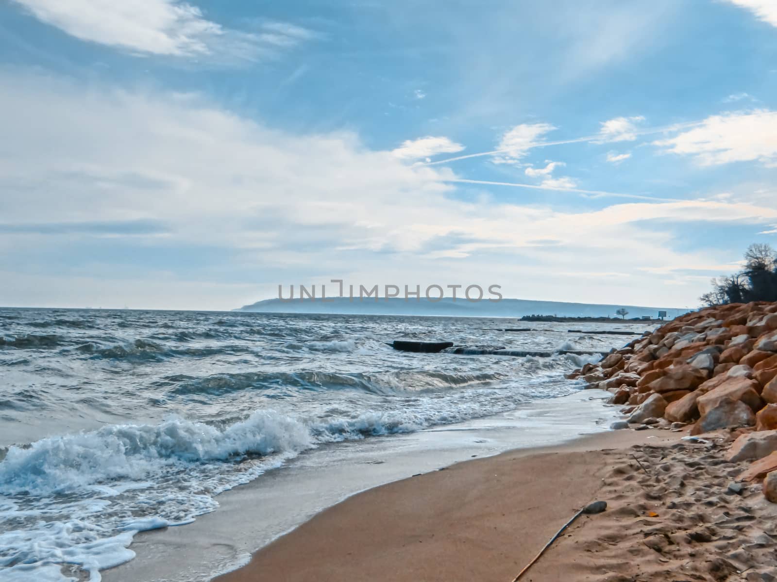 Seashore combined with some stormy waves and puffy clouds. by justbrotography