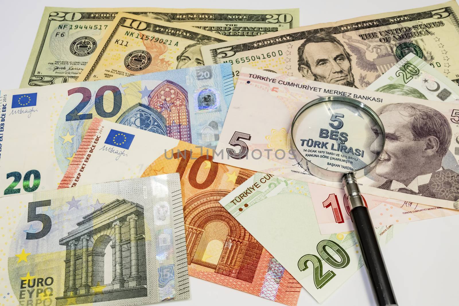 close up turkish lira, american dollar and euro banknotes on background