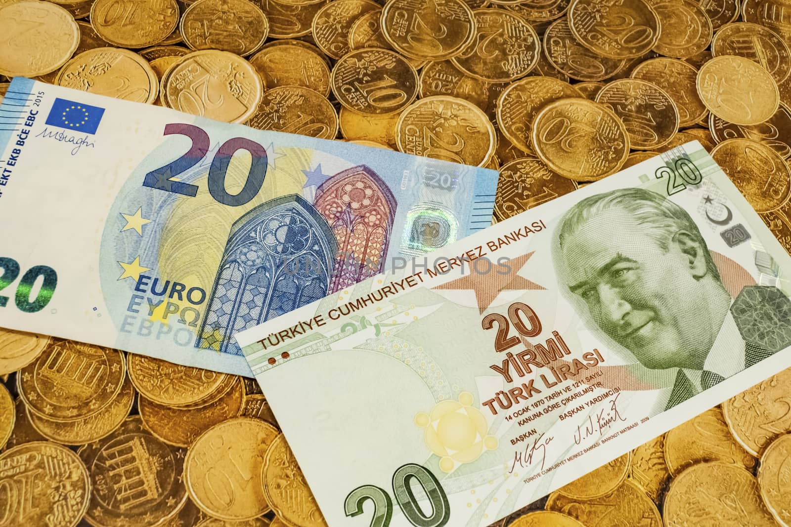 close up turkish lira banknotes with euro bankmotes on background