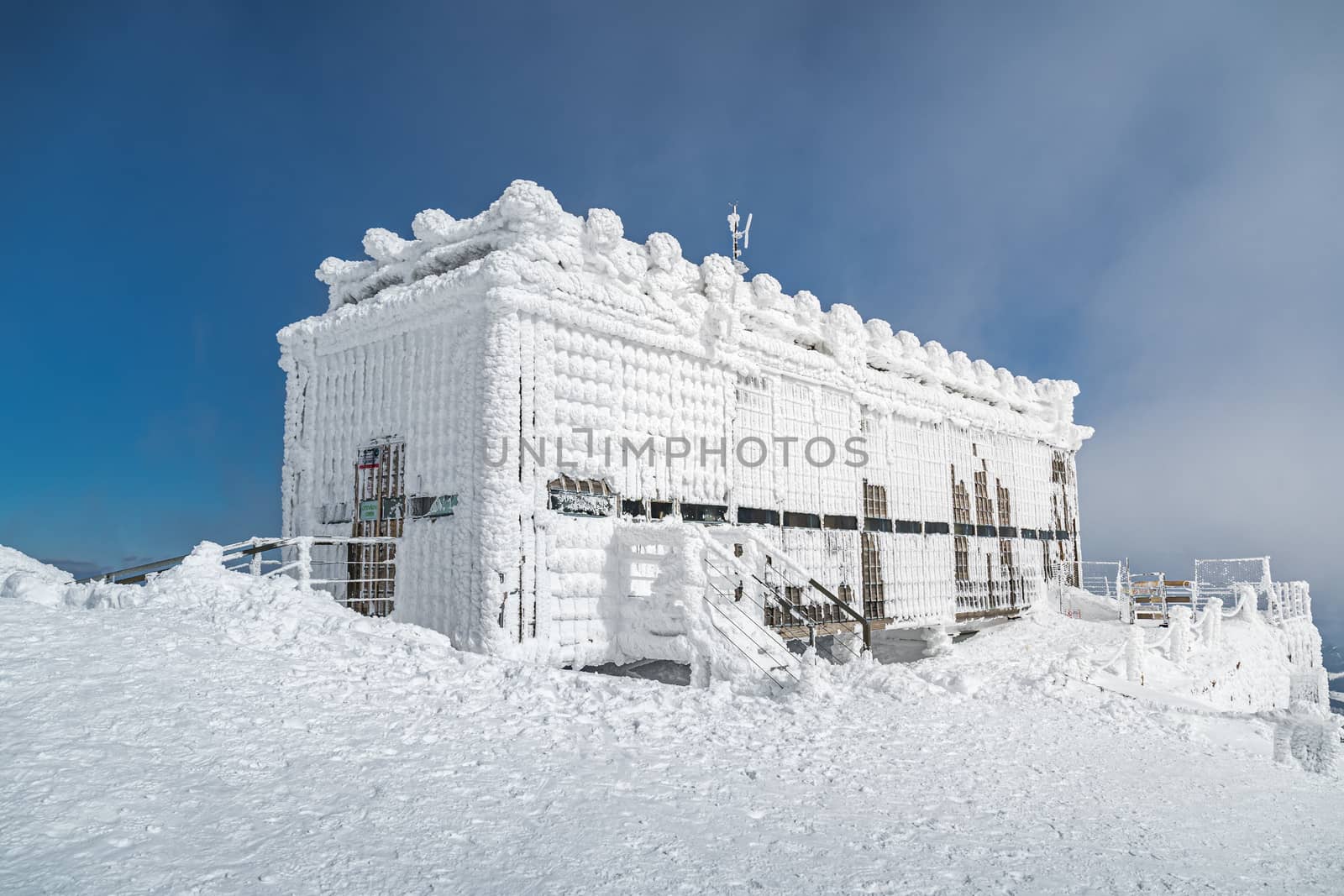 Post office called Postovna on top of Snezka covered with frost. The peak of the Snezka Mountain in winter in the Krkonose Mountains.