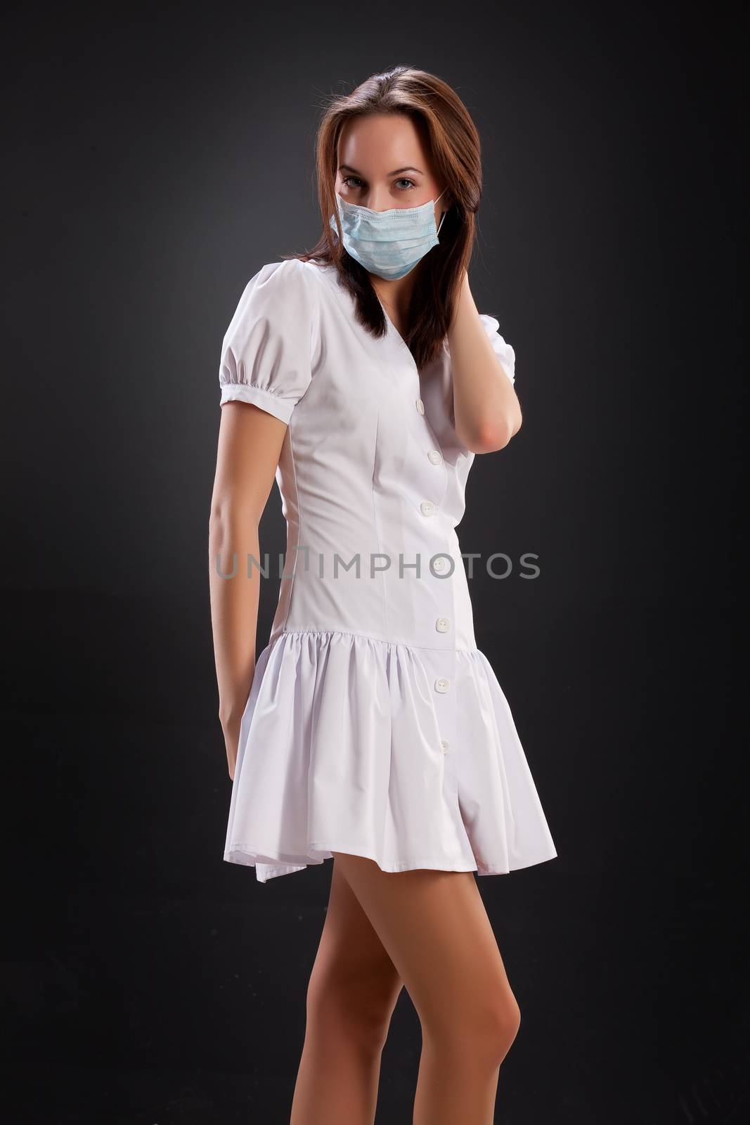 Young attractive woman in a nurse uniform with a stetyoscope