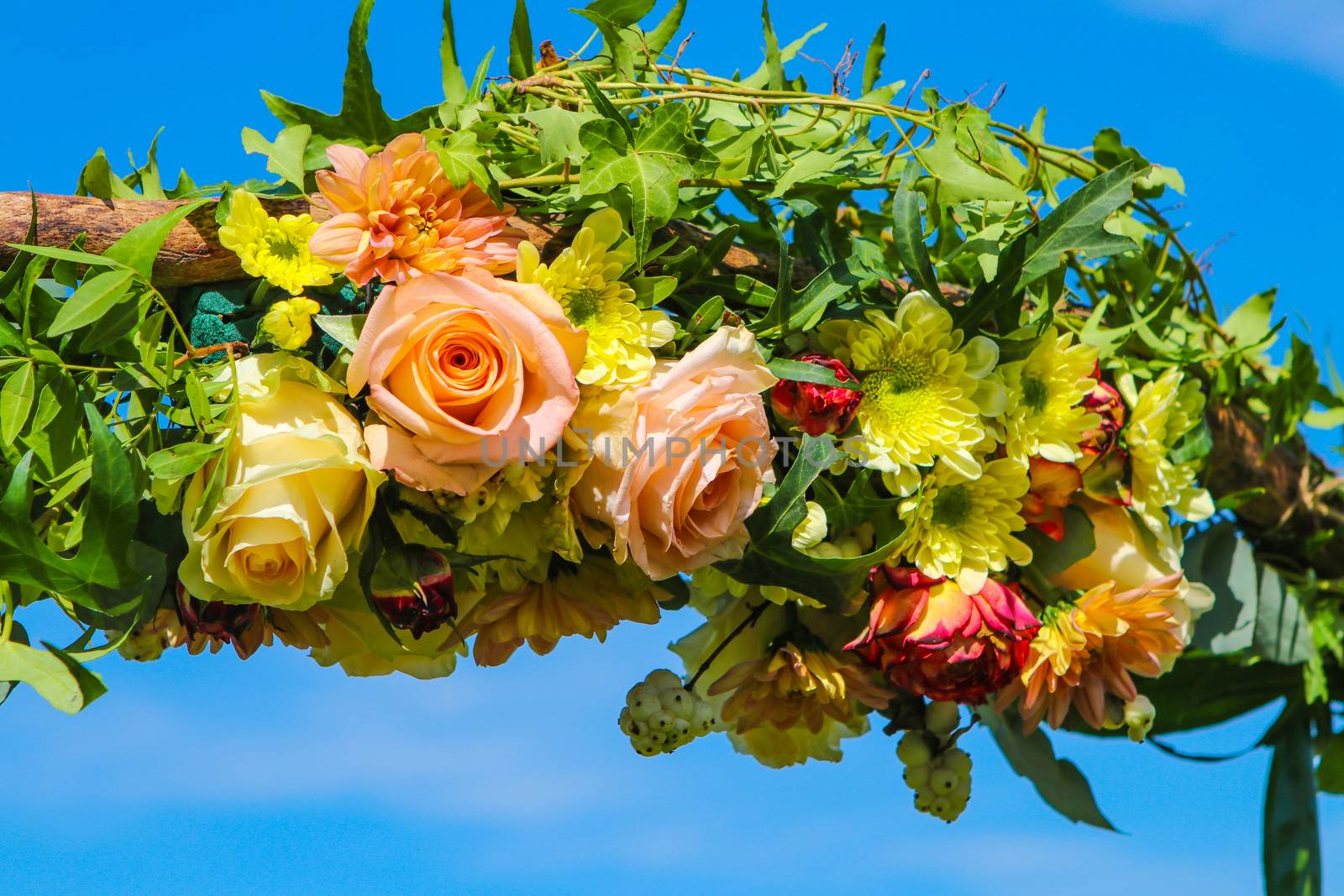 wedding flowers with roses on blue sky background with copy space